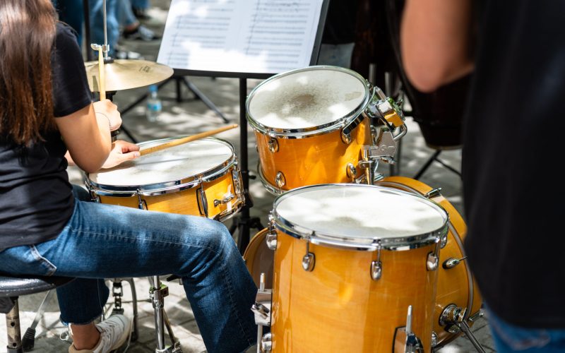 Female musician percussionist playing drums
