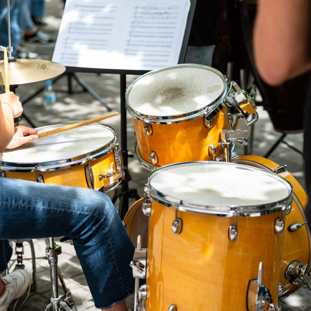 Female musician percussionist playing drums